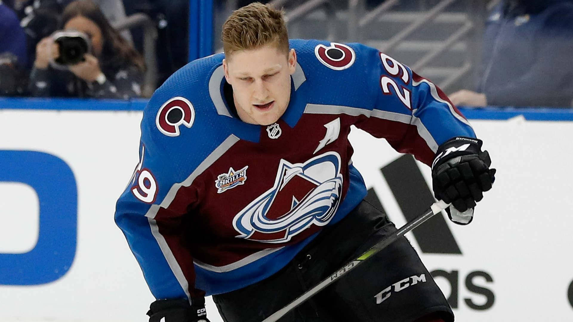 Nathan Mackinnon Of Colorado Avalanche In Action Background