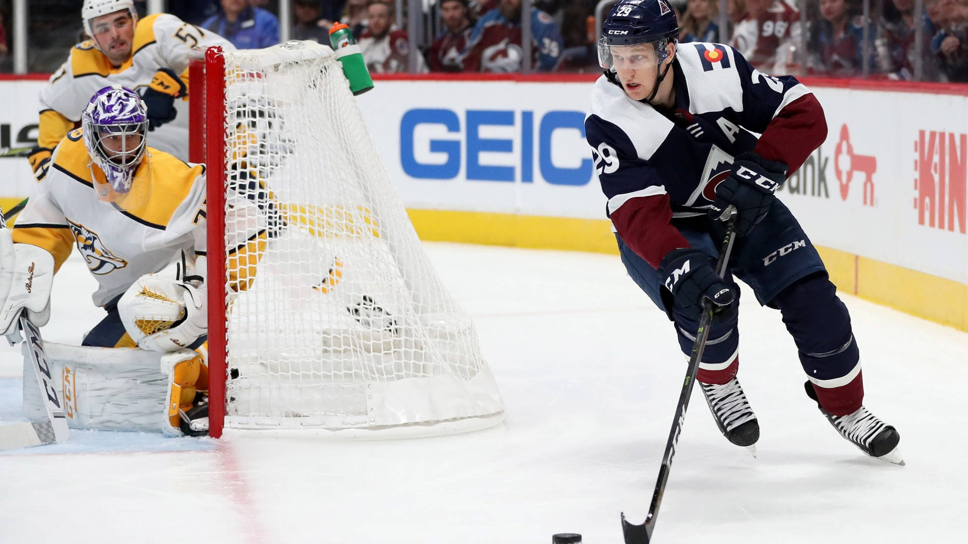 Nathan Mackinnon Playing Against Opponent Background