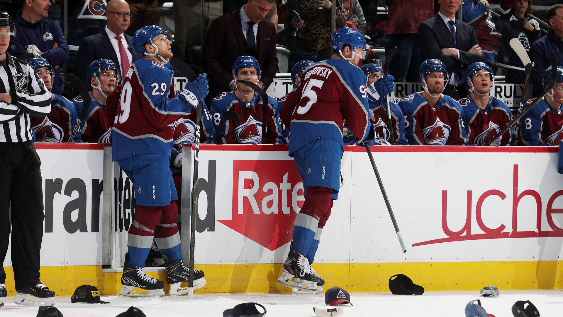 Nathan Mackinnon With Teammates In Intense Discussion During Game Background