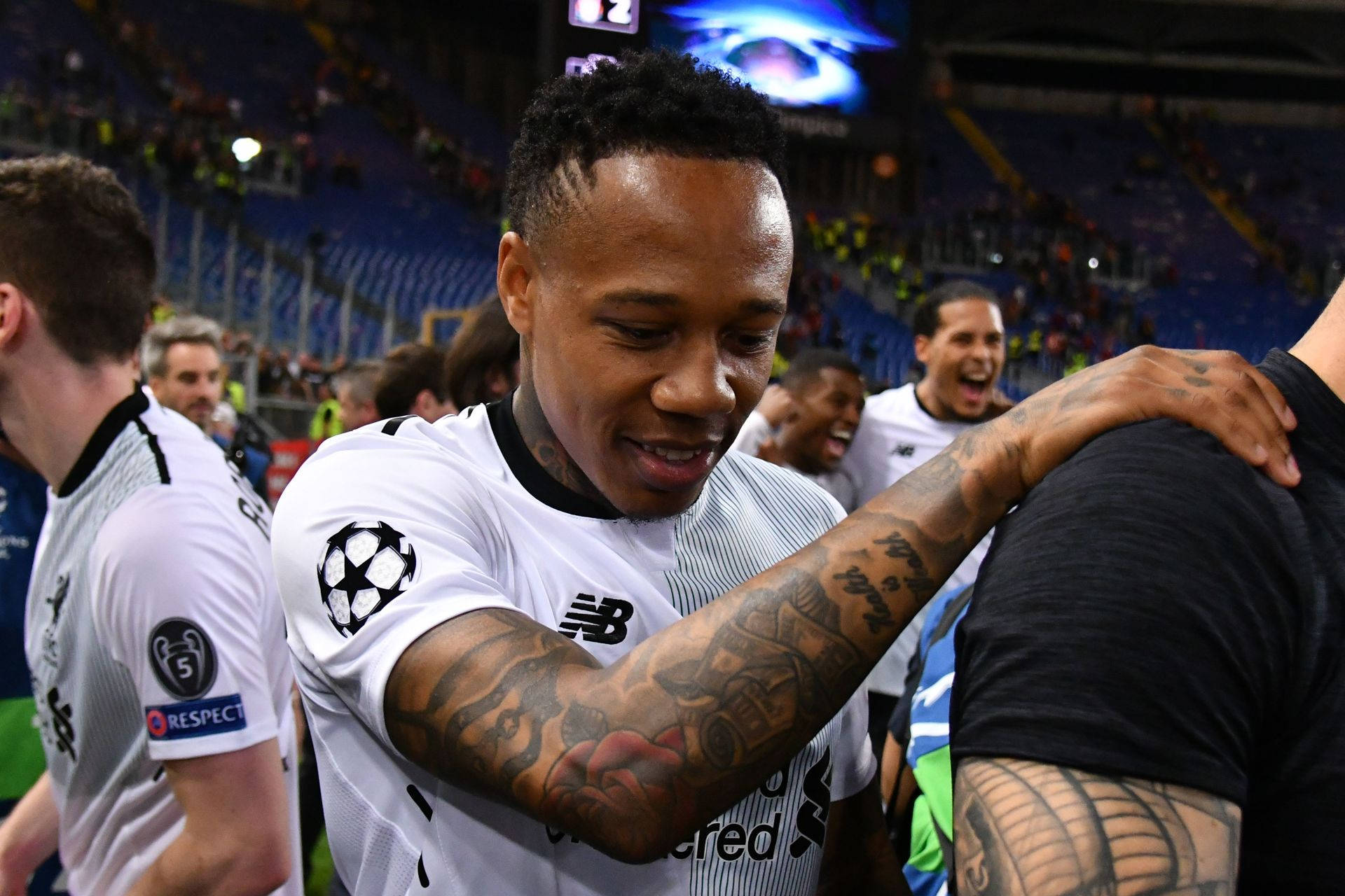 Nathaniel Clyne Holding On To Person Background