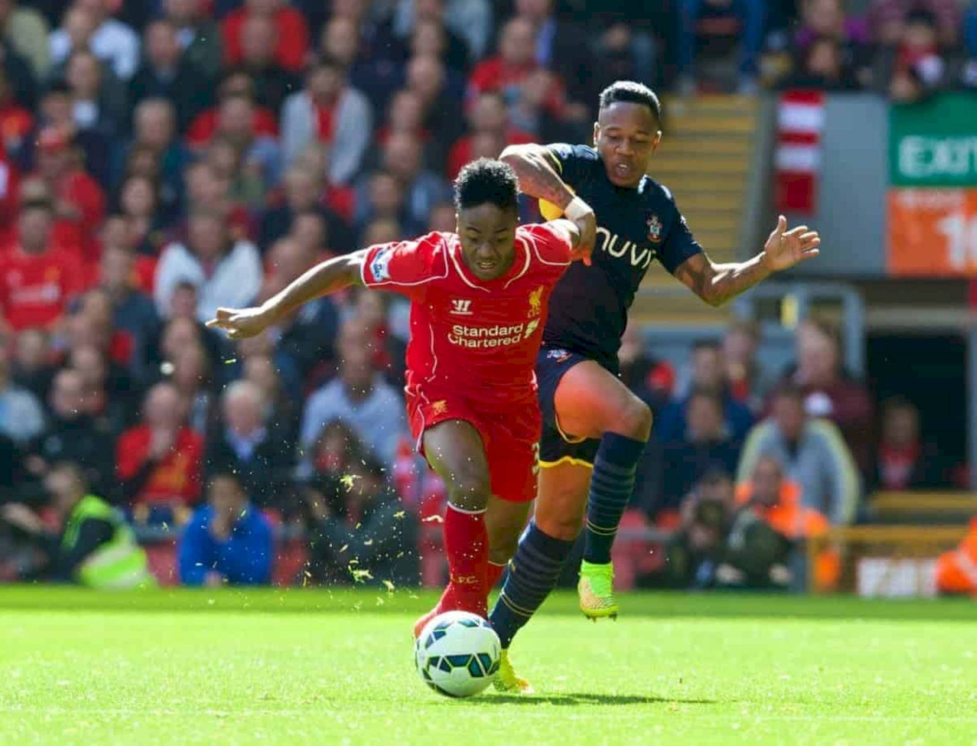 Nathaniel Clyne In Front Of Opponent Background