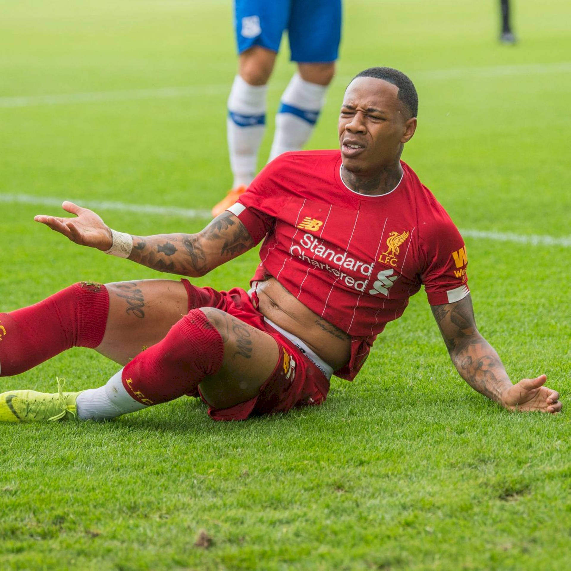 Nathaniel Clyne Sitting On The Field Background