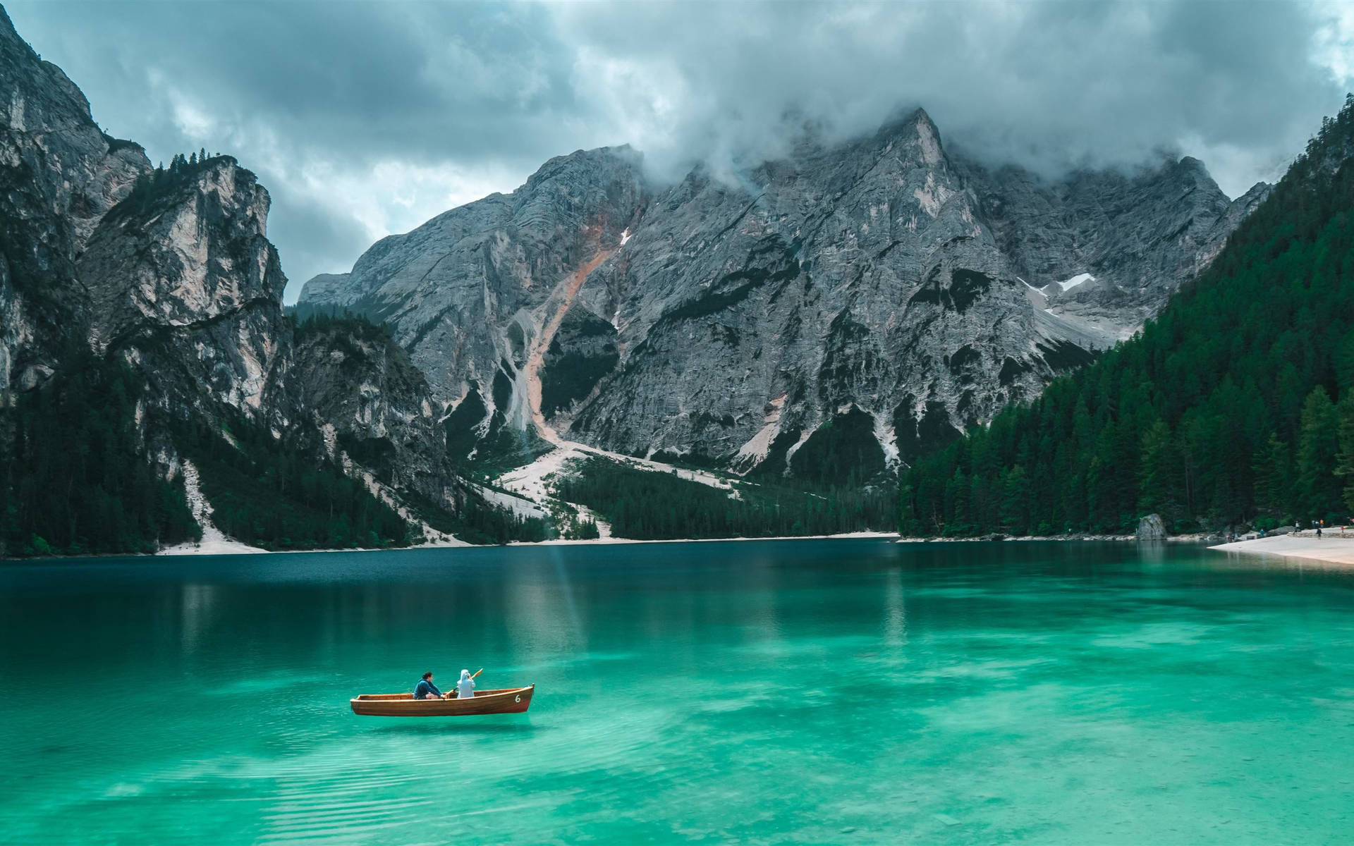 Natural Blue Lake With Boat Among Mountains Background