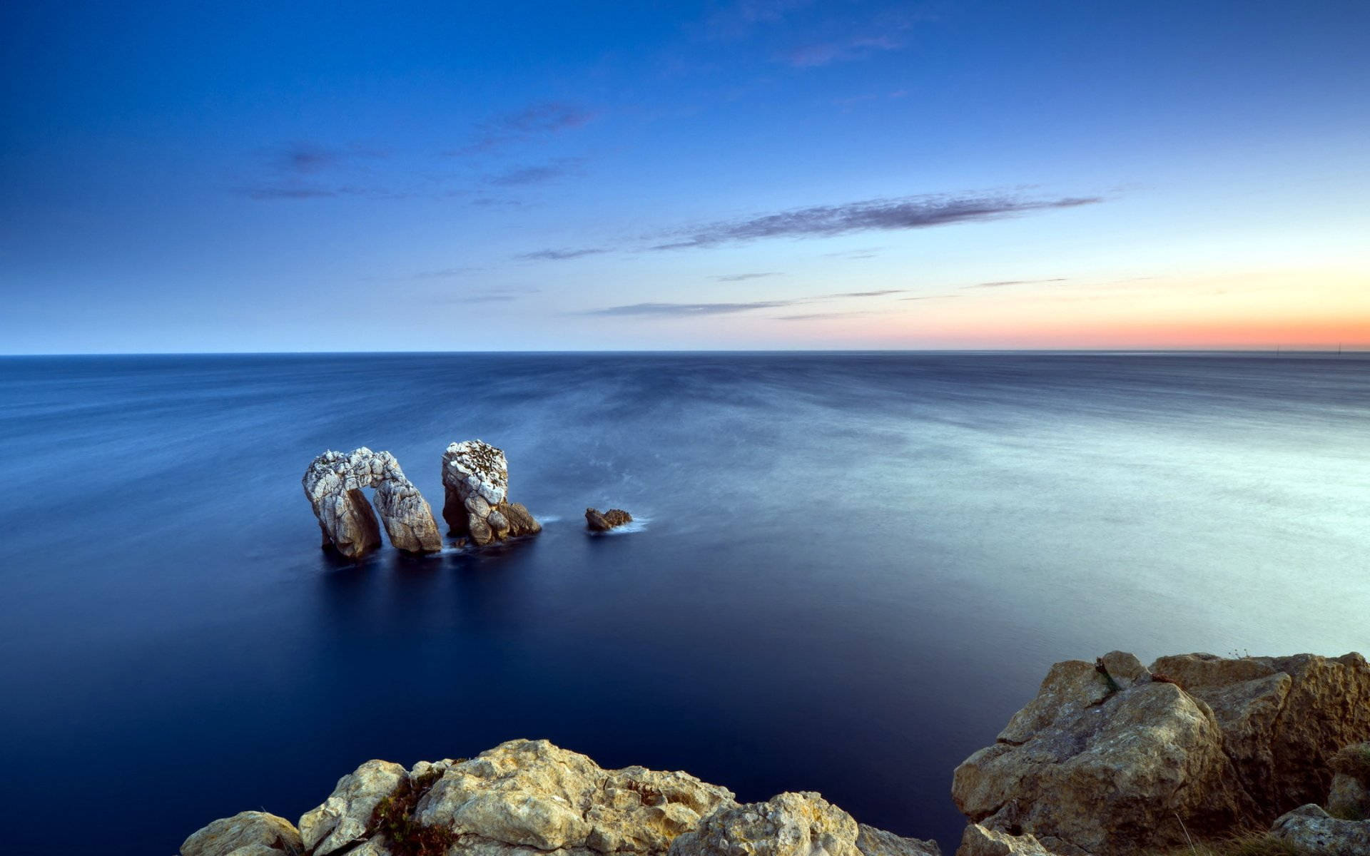 Natural Rock Formations At Sea Background