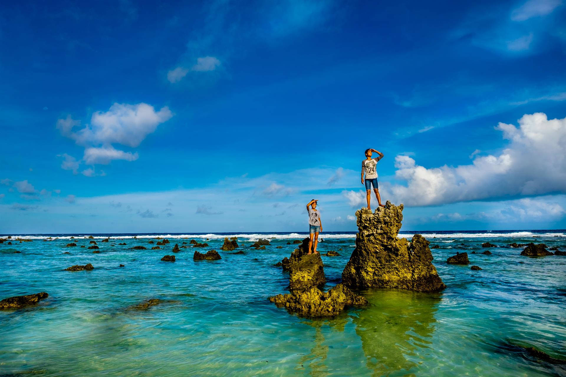 Nauru Islanders On Rocks Background