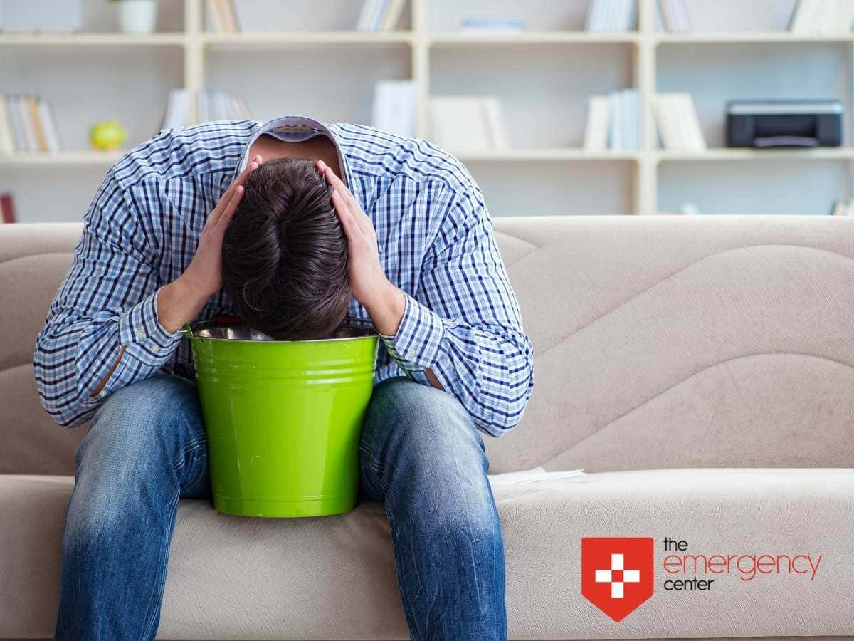 Nauseous Man With Green Bucket Background