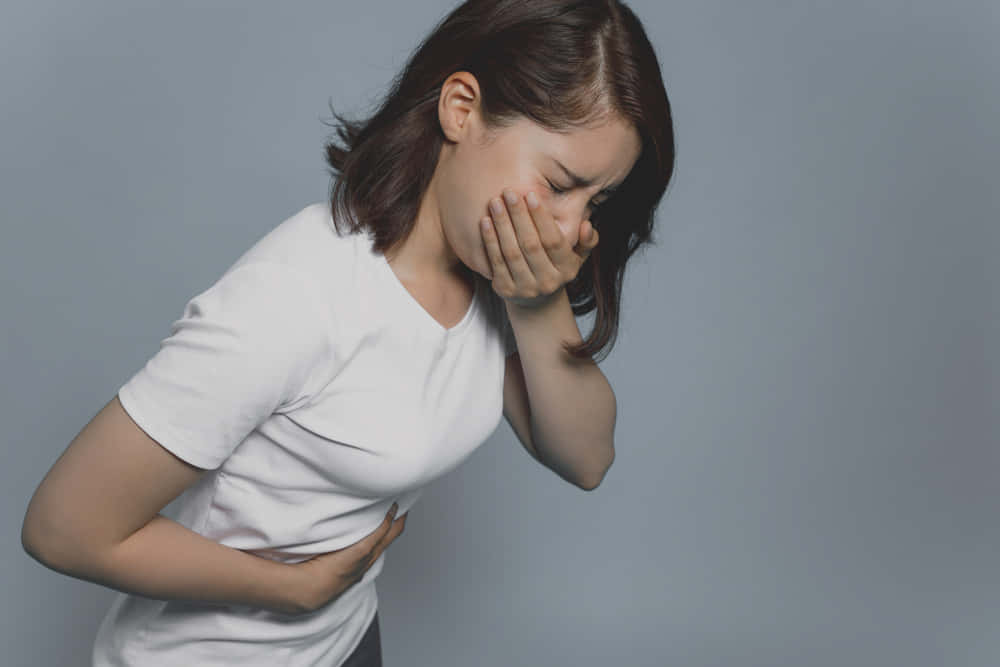 Nauseous Woman In White Shirt Background