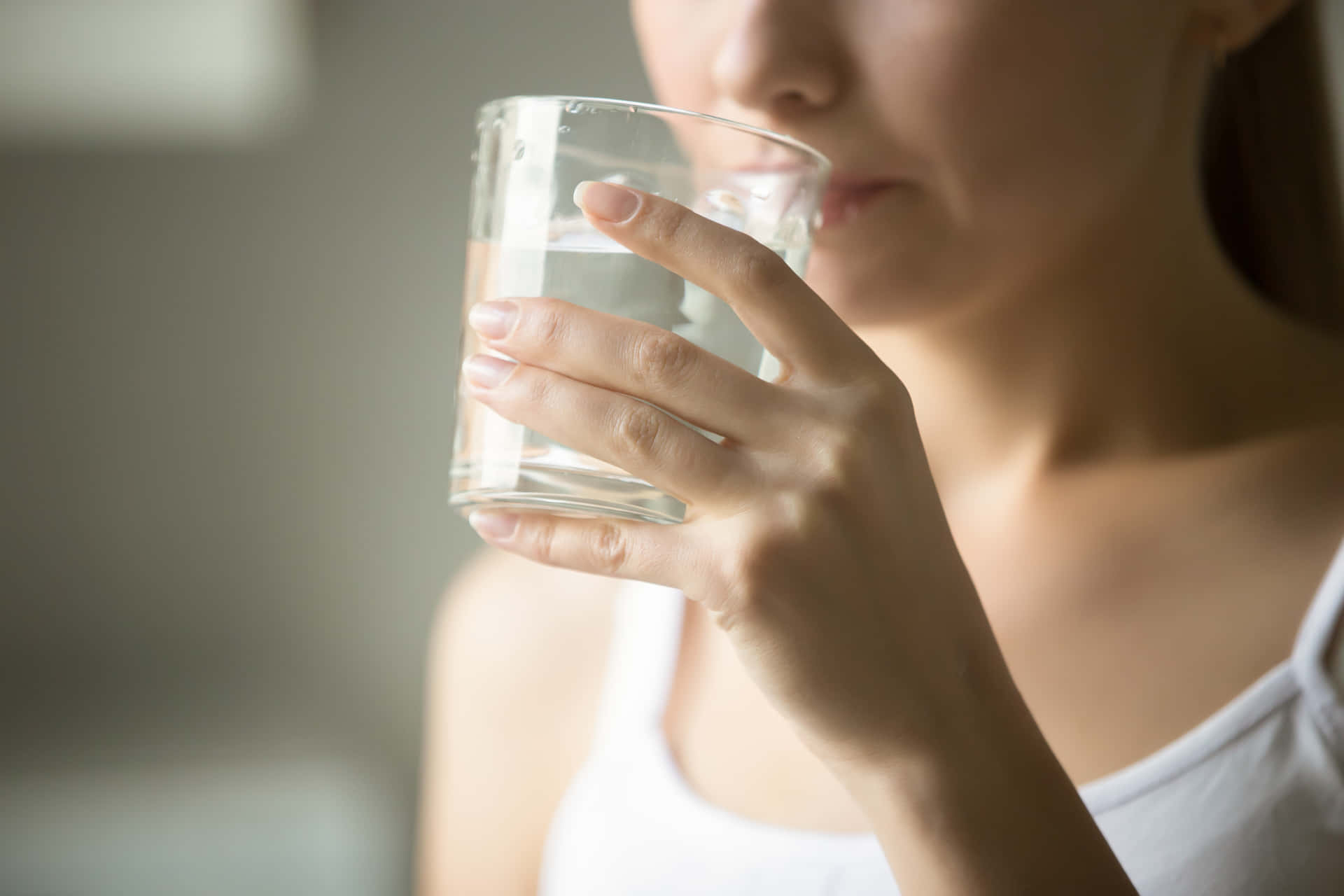 Nauseous Woman With Water Up-close Background