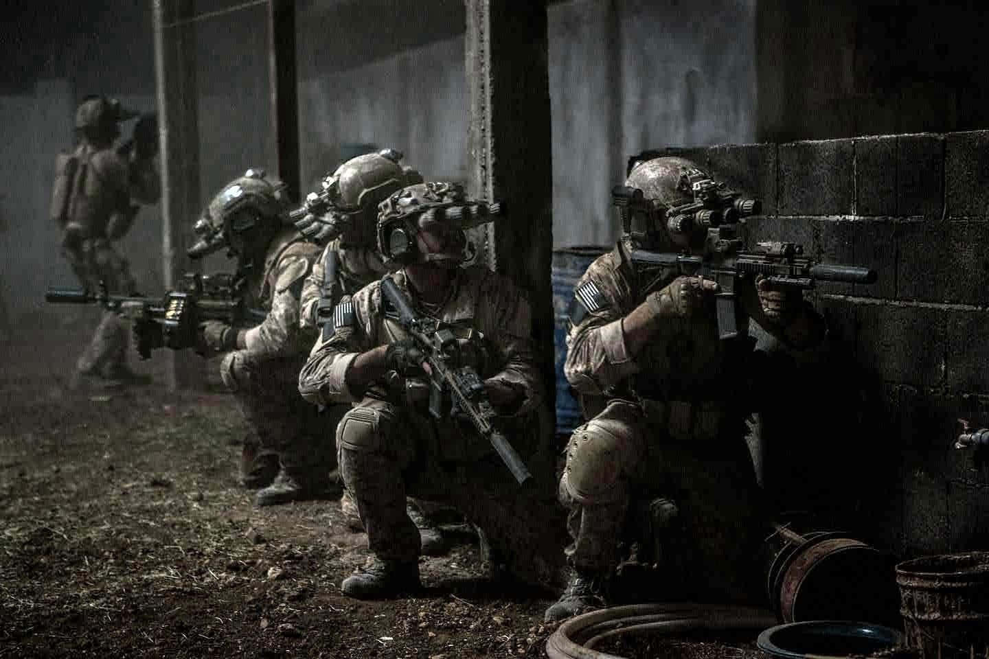 Navy Seal Team Swimmers Emerge From The Sea Background