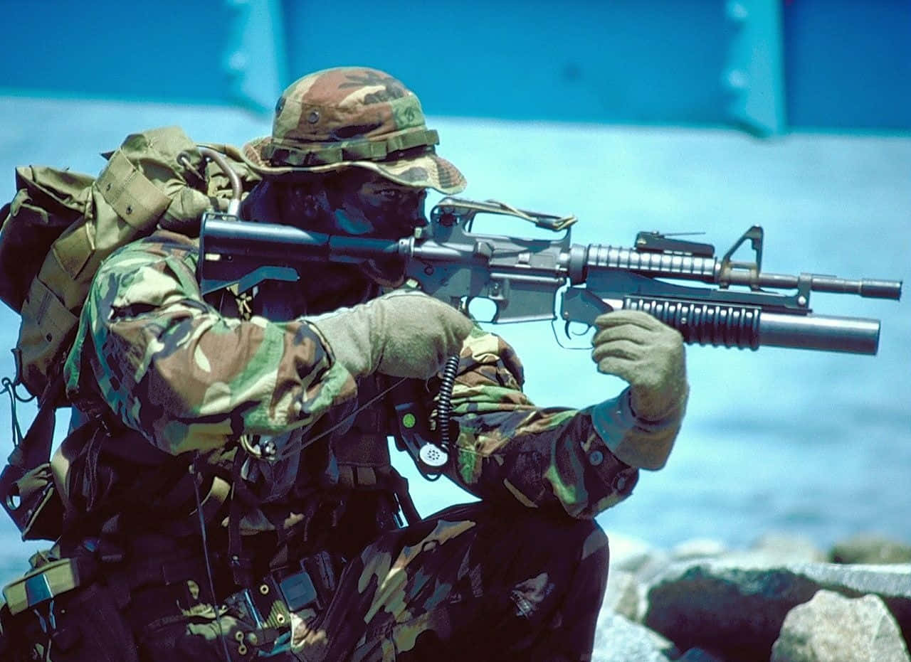 Navy Seals Armed With Military Gear Background