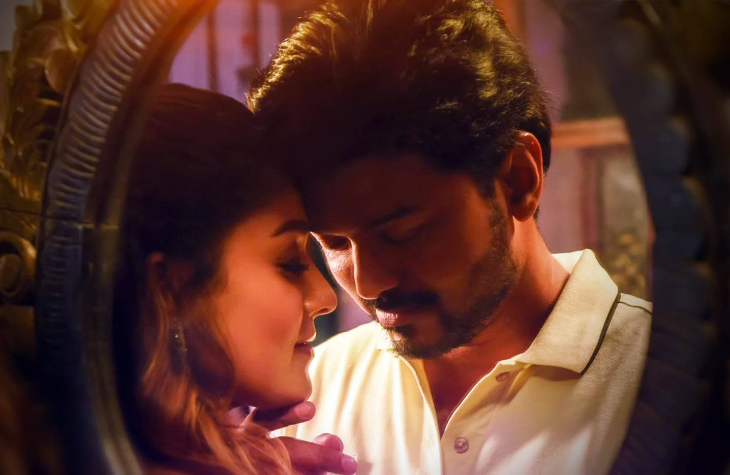 Nayanthara And Vijay Sharing An Intimate Moment On A Mirror Reflection Background