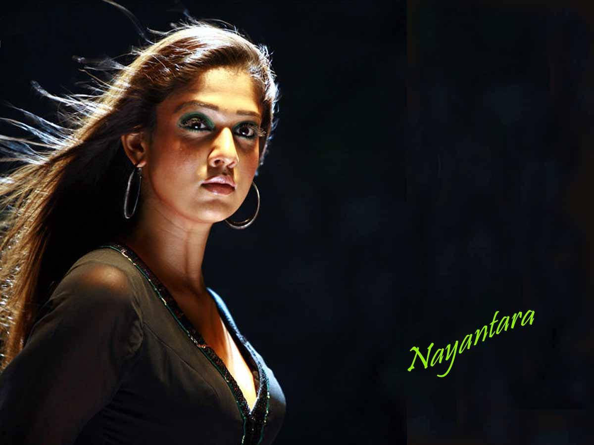 Nayanthara Stunning In Black Dress With Windswept Hair Background