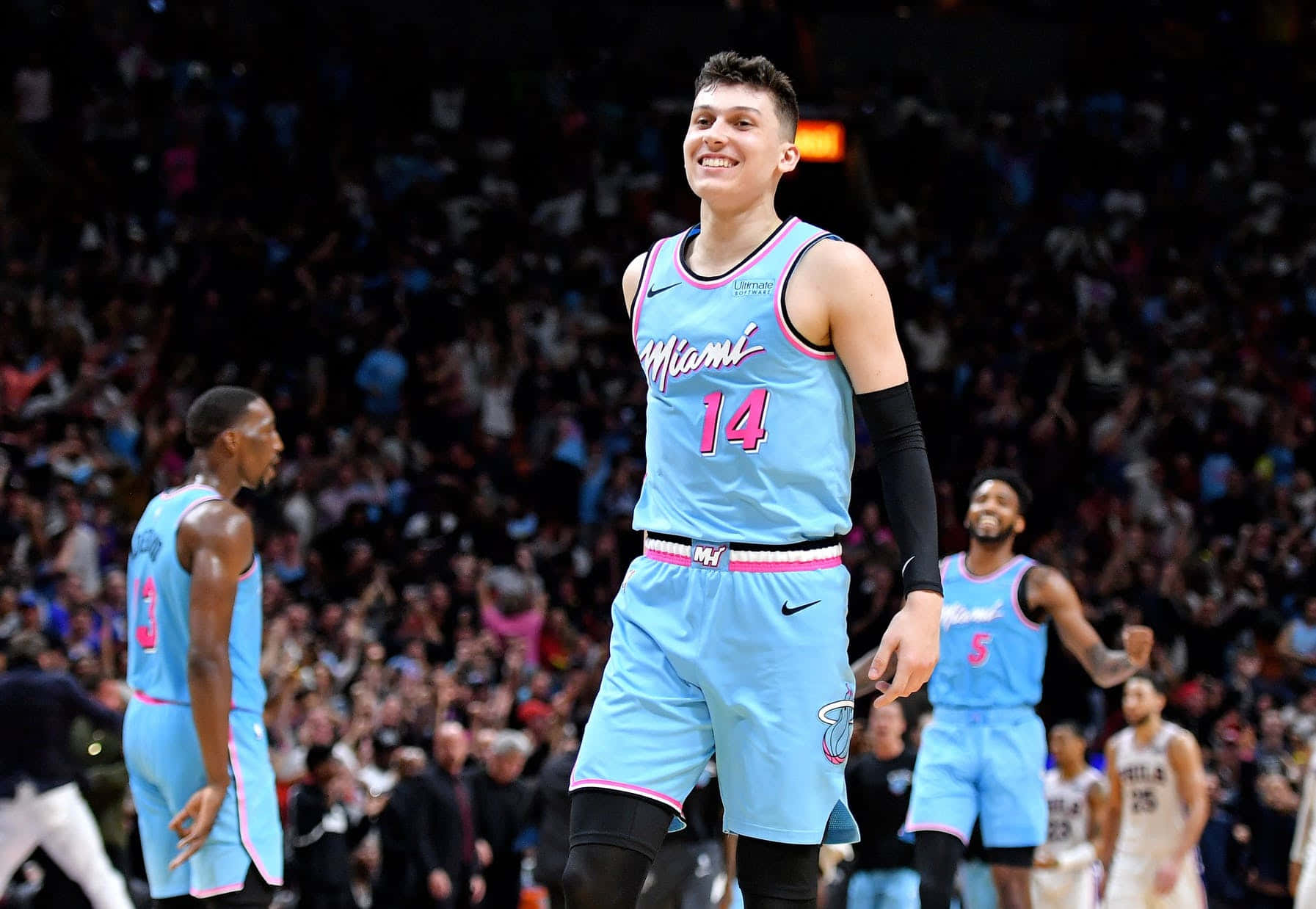 Nba Champion Tyler Herro Displays The Larry O'brien Trophy Background