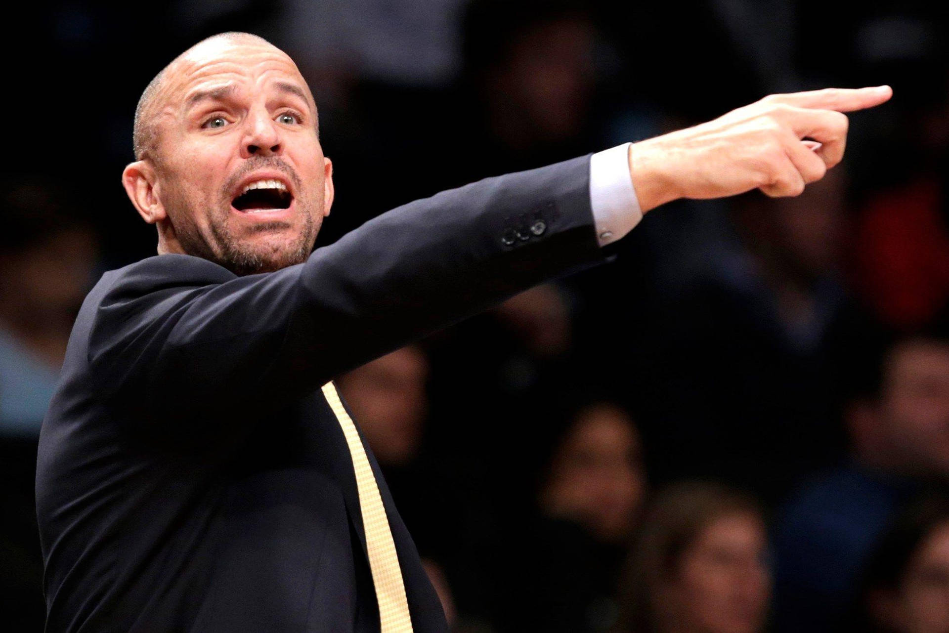 Nba Coach Jason Kidd Pointing Background