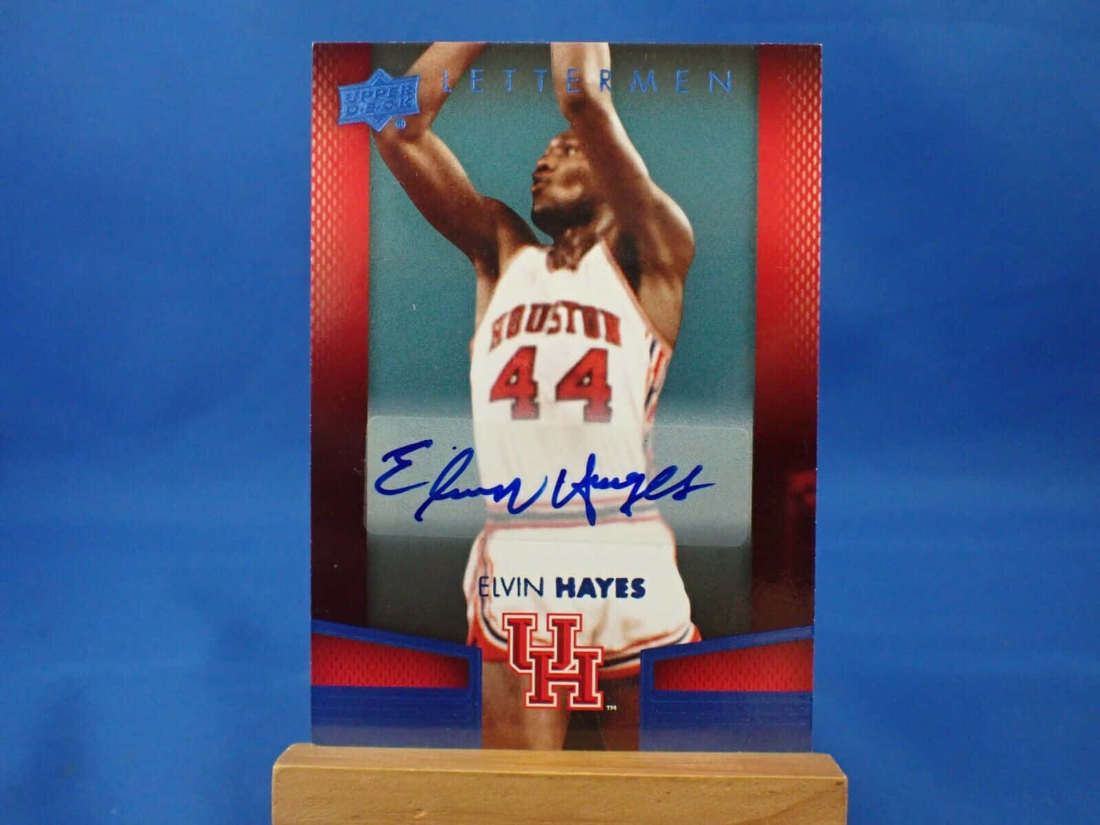 Nba Legend Elvin Hayes Against A Signature Blue Background Background