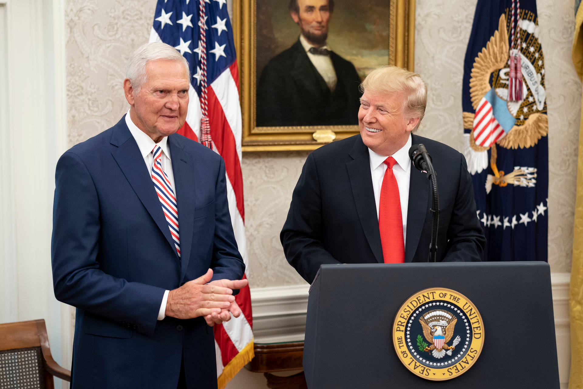 Nba Legend Jerry West Receiving An Award From President Donald Trump Background