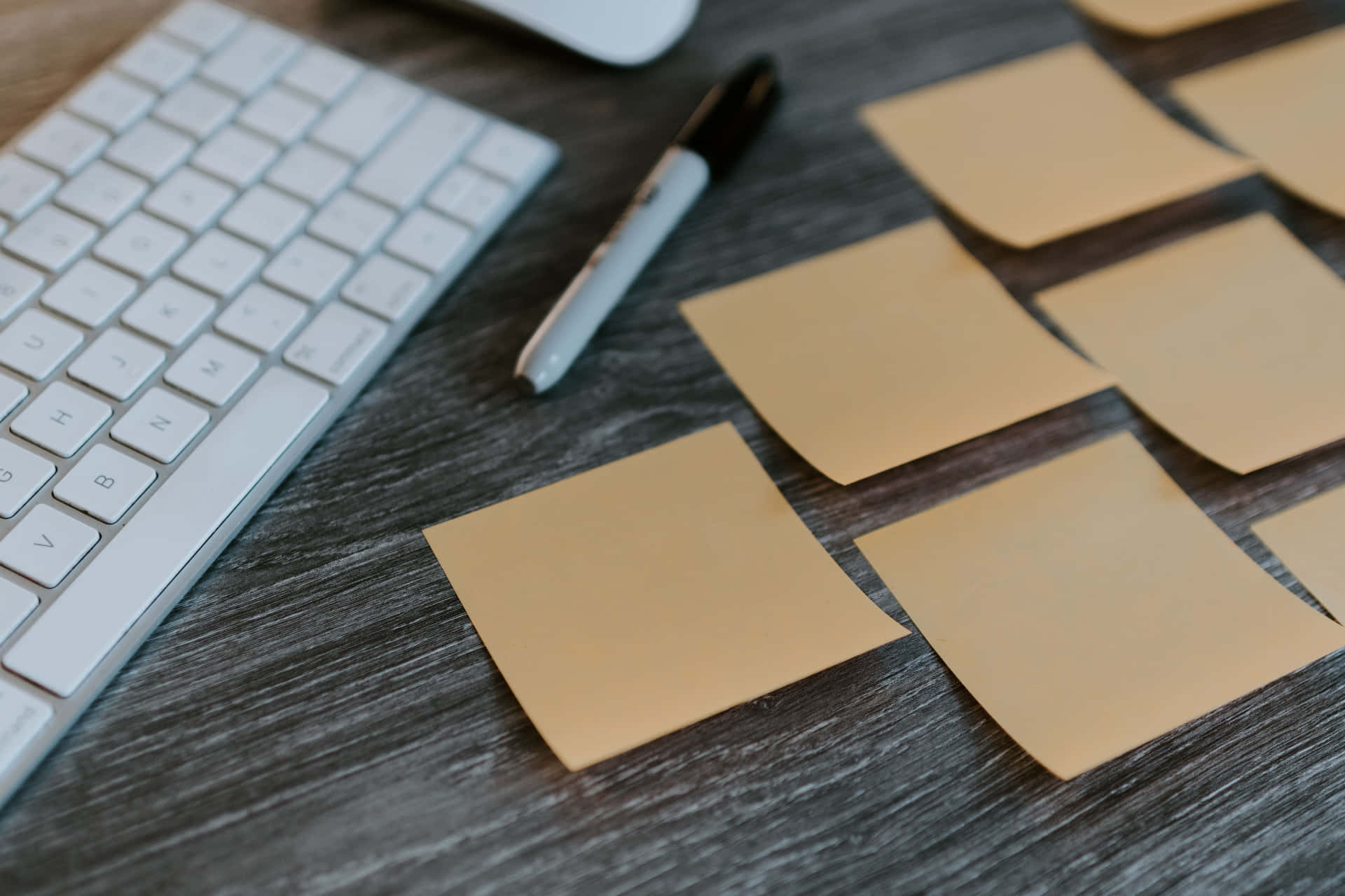 Neat And Organized Sticky Notes Over Desk