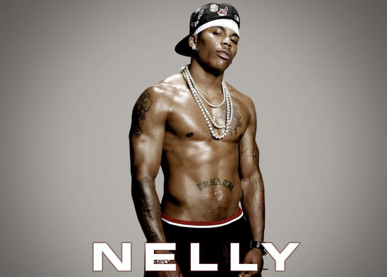 Nelly Shirtless With A Fierce Expression With Name Background