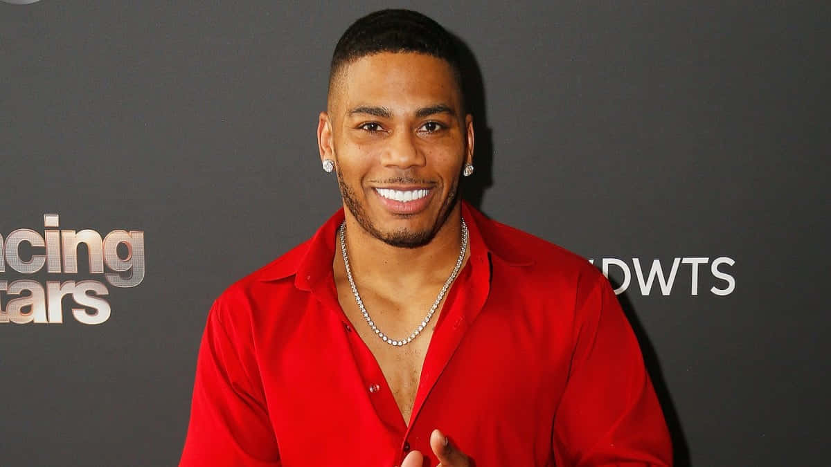Nelly Smiling In Front Of Dancing With The Stars Poster Background