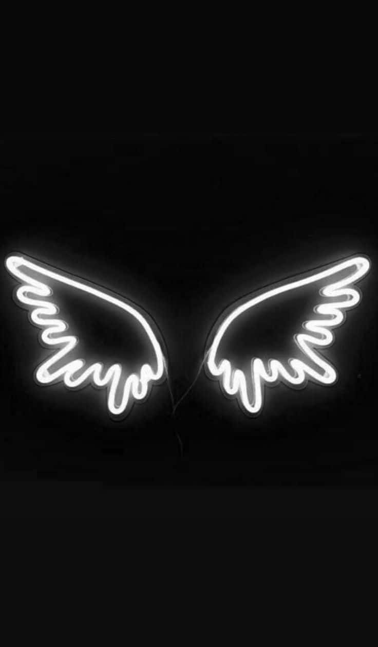 Neon Angel Wings On A Black Background