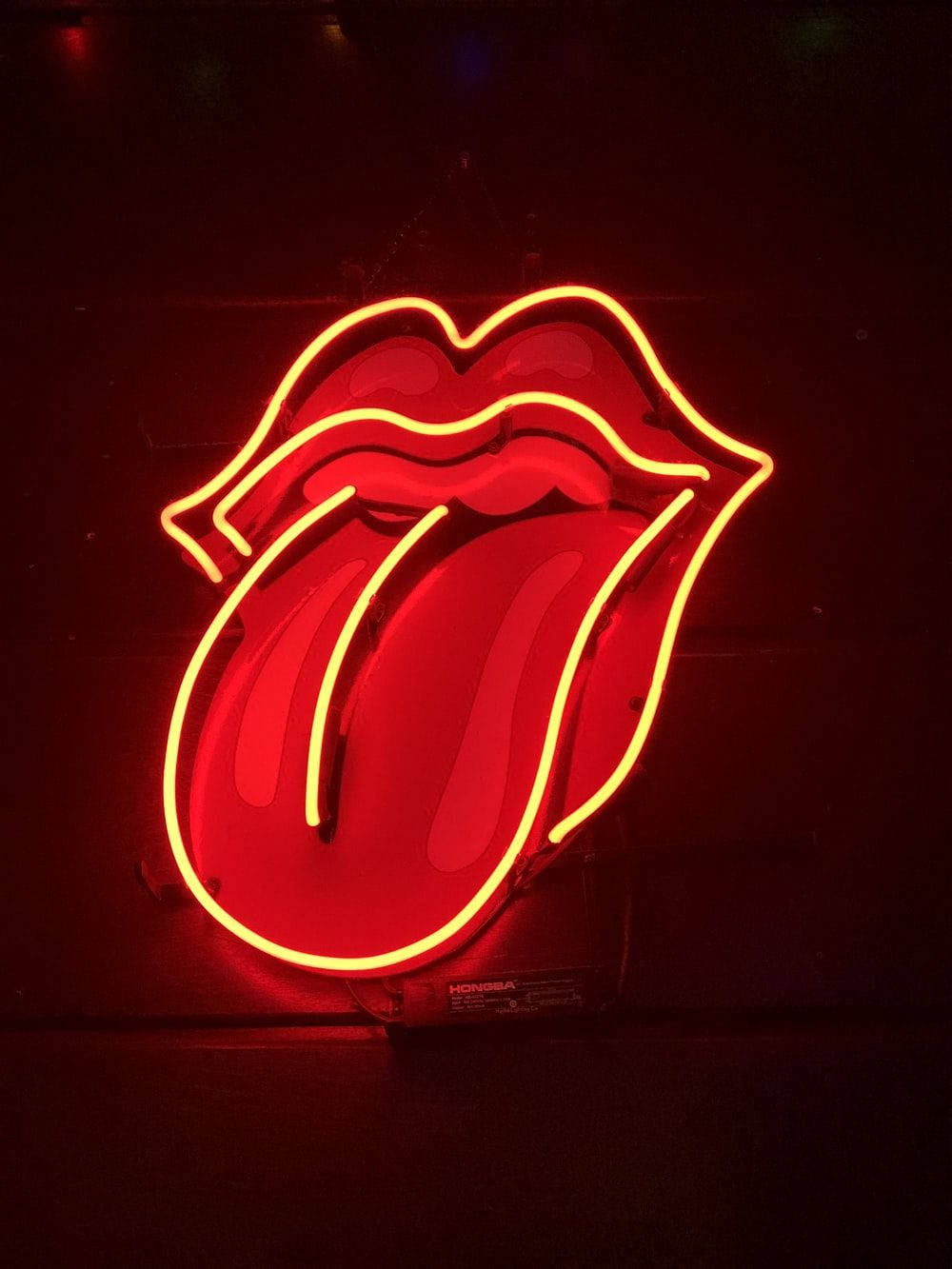 Neon Orange Aesthetic Rolling Stones Logo Background