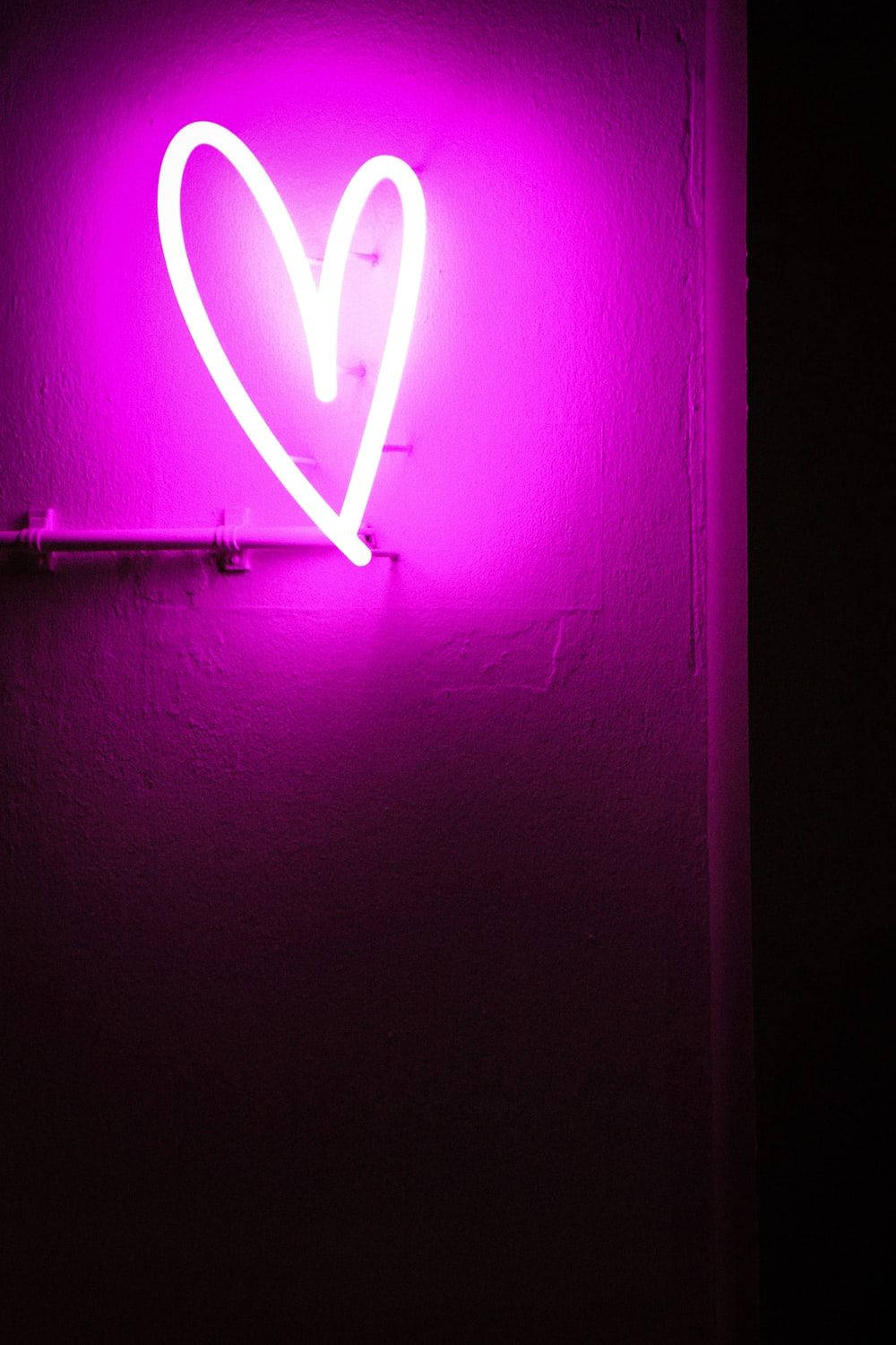 Neon Pink Heart Sign Background