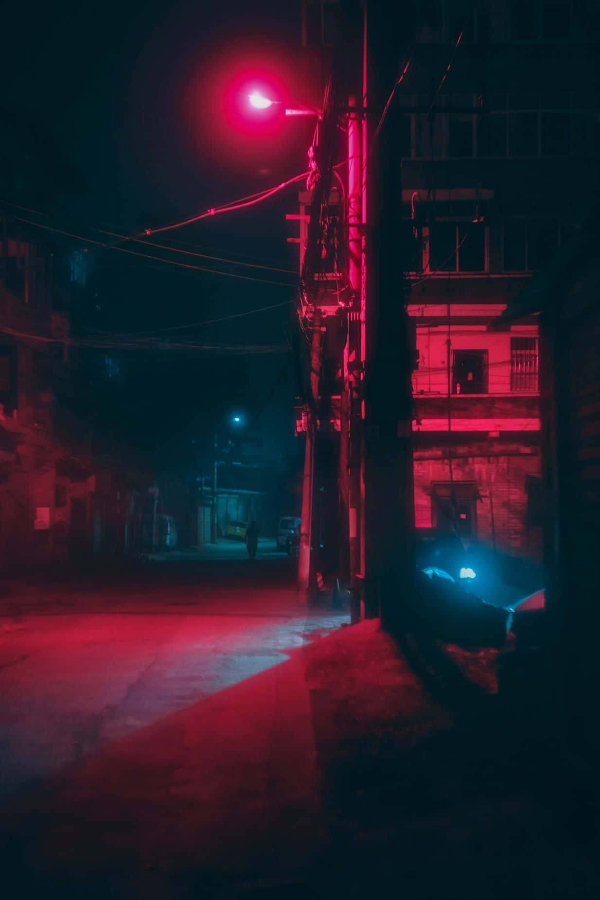 Neon Red Aesthetic Light Illuminating A Street Background