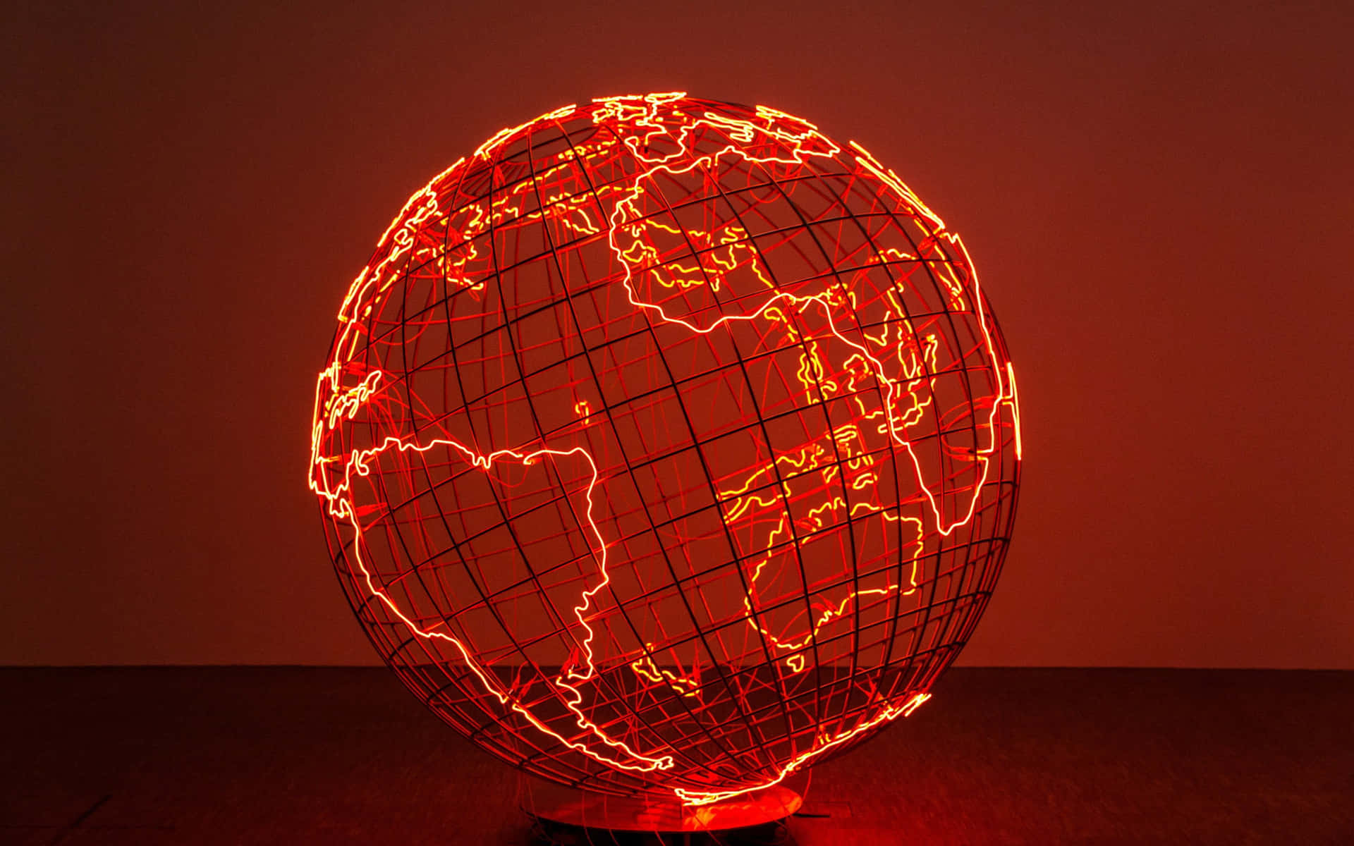 Neon Red Sculpture Of Globe Map