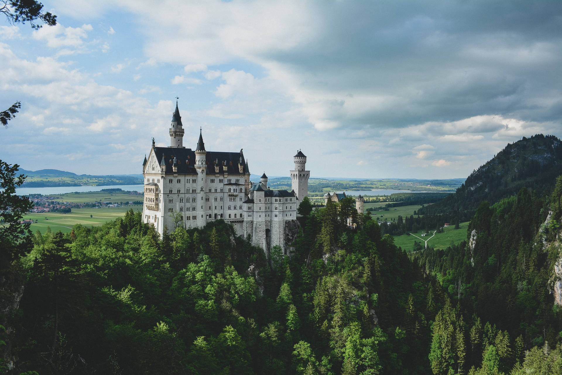 Neuschwanstein Castle Dark Clouds Overhead Background