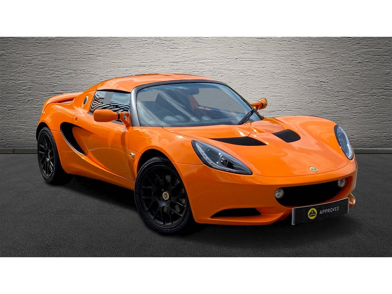 New 2010 Lotus Elise Orange Sports Car Background