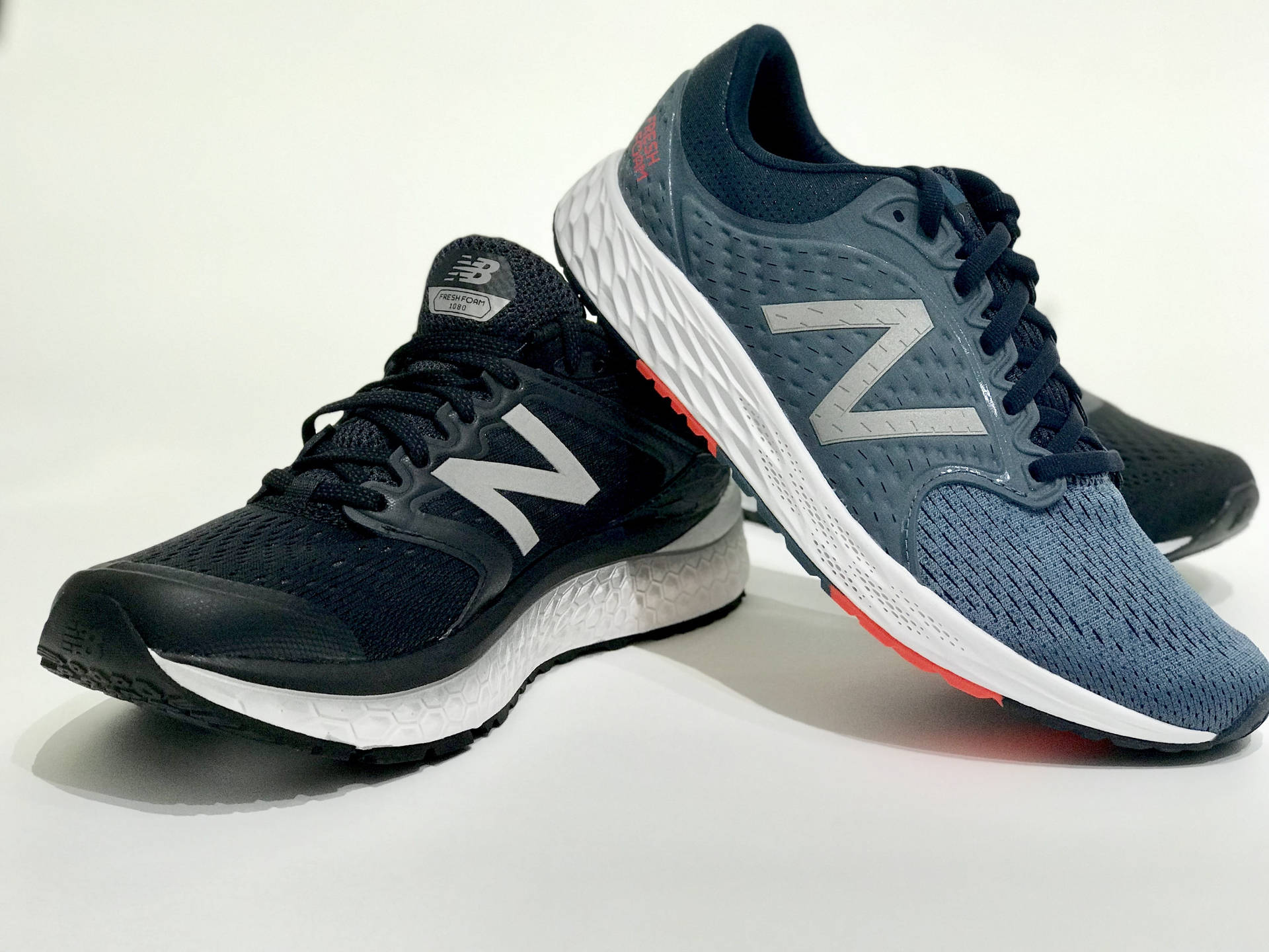 New Balance Different Coloured Pair Background