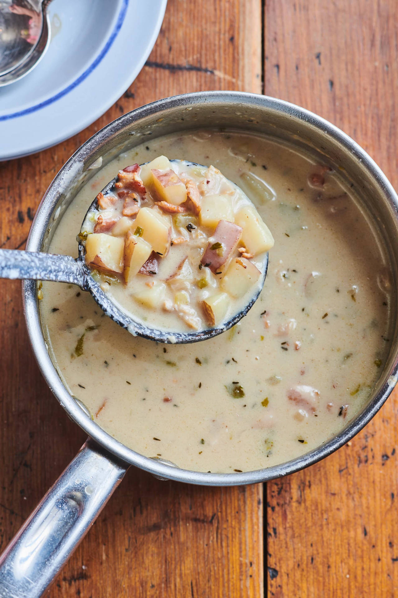 New England Clam Chowder Soup In Silverware Scoop