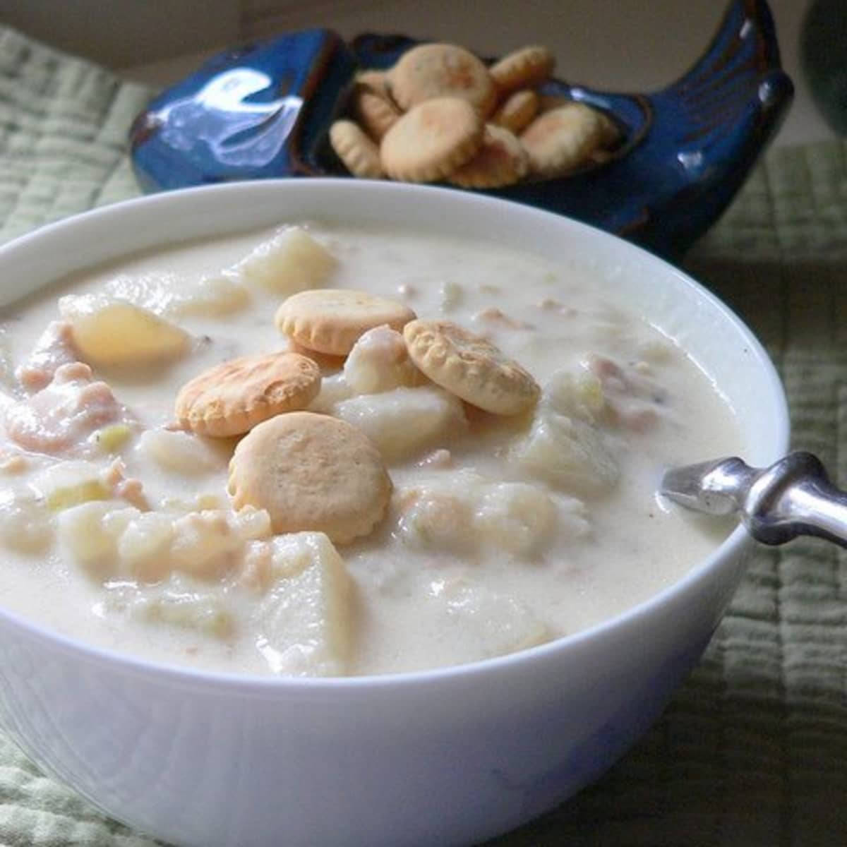 New England Clam Chowder Soup Topped With Crackers Background