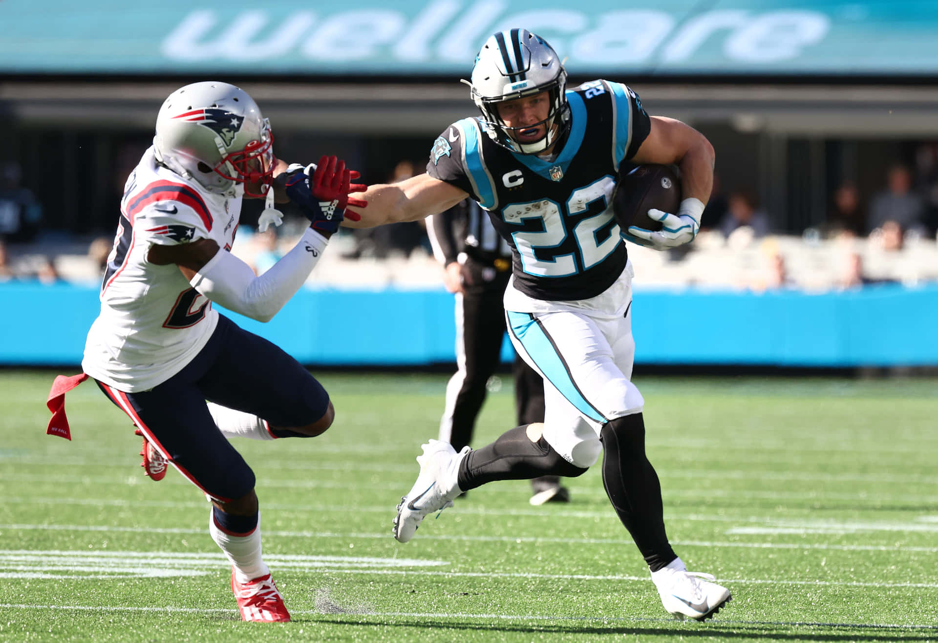 New England Patriots Jc Jackson Tries To Tackle Christian Mccaffrey Background