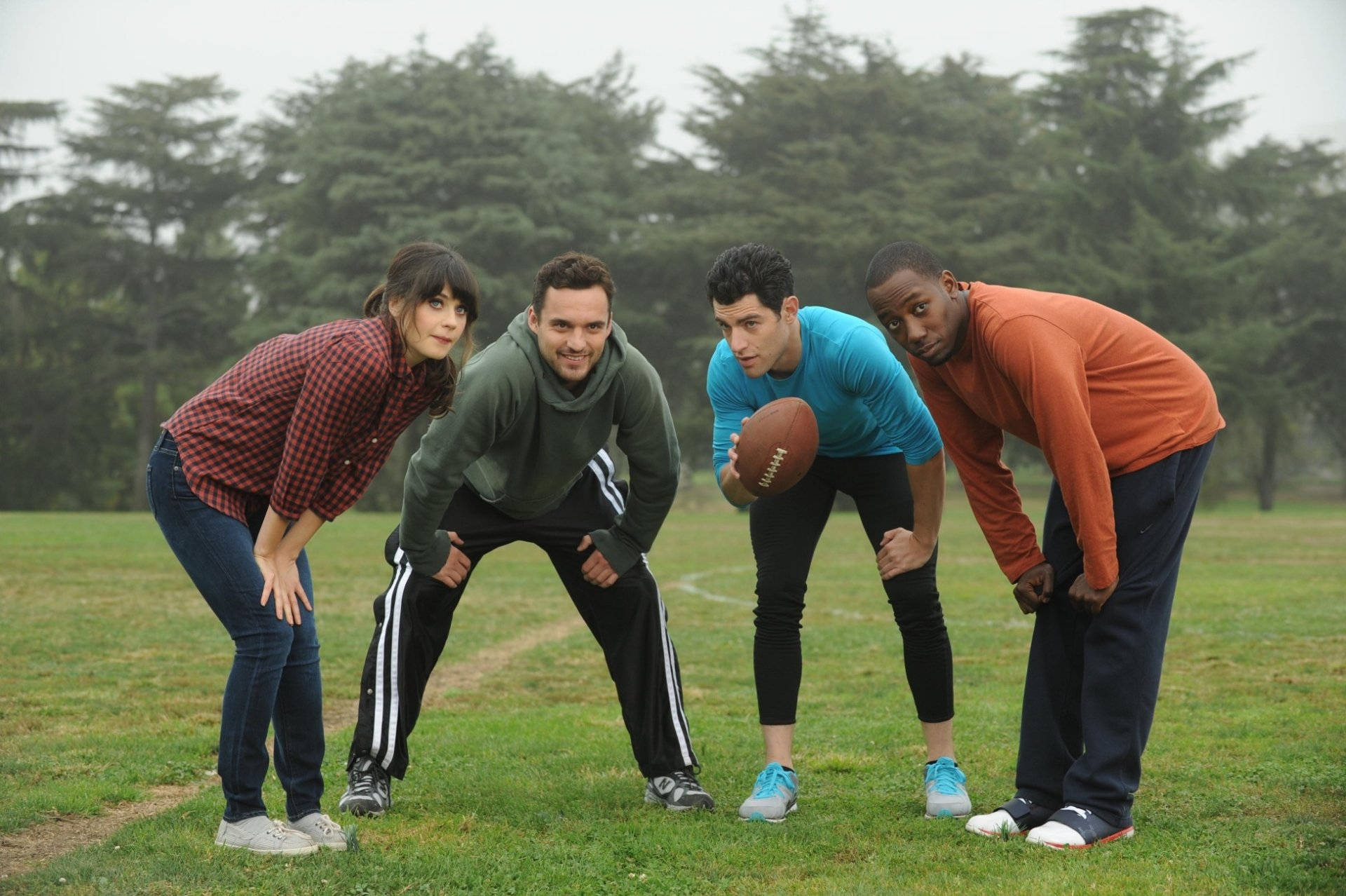 New Girl Cast On Football Field Background