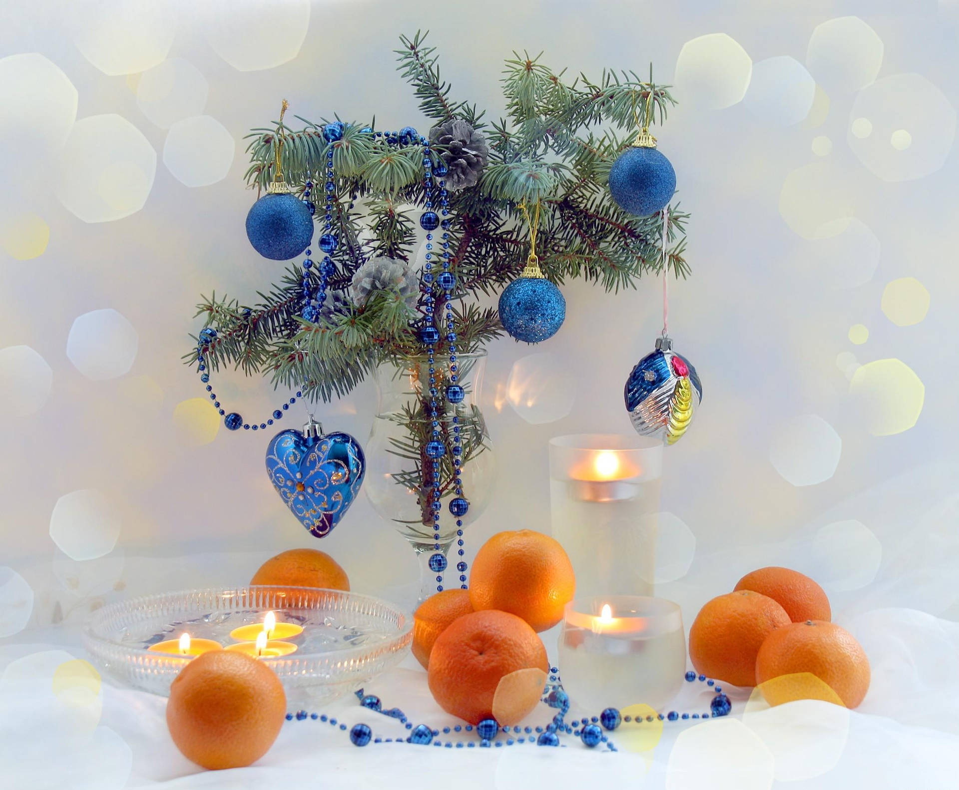 New Year's Decorations With Candles And Tangerines Background