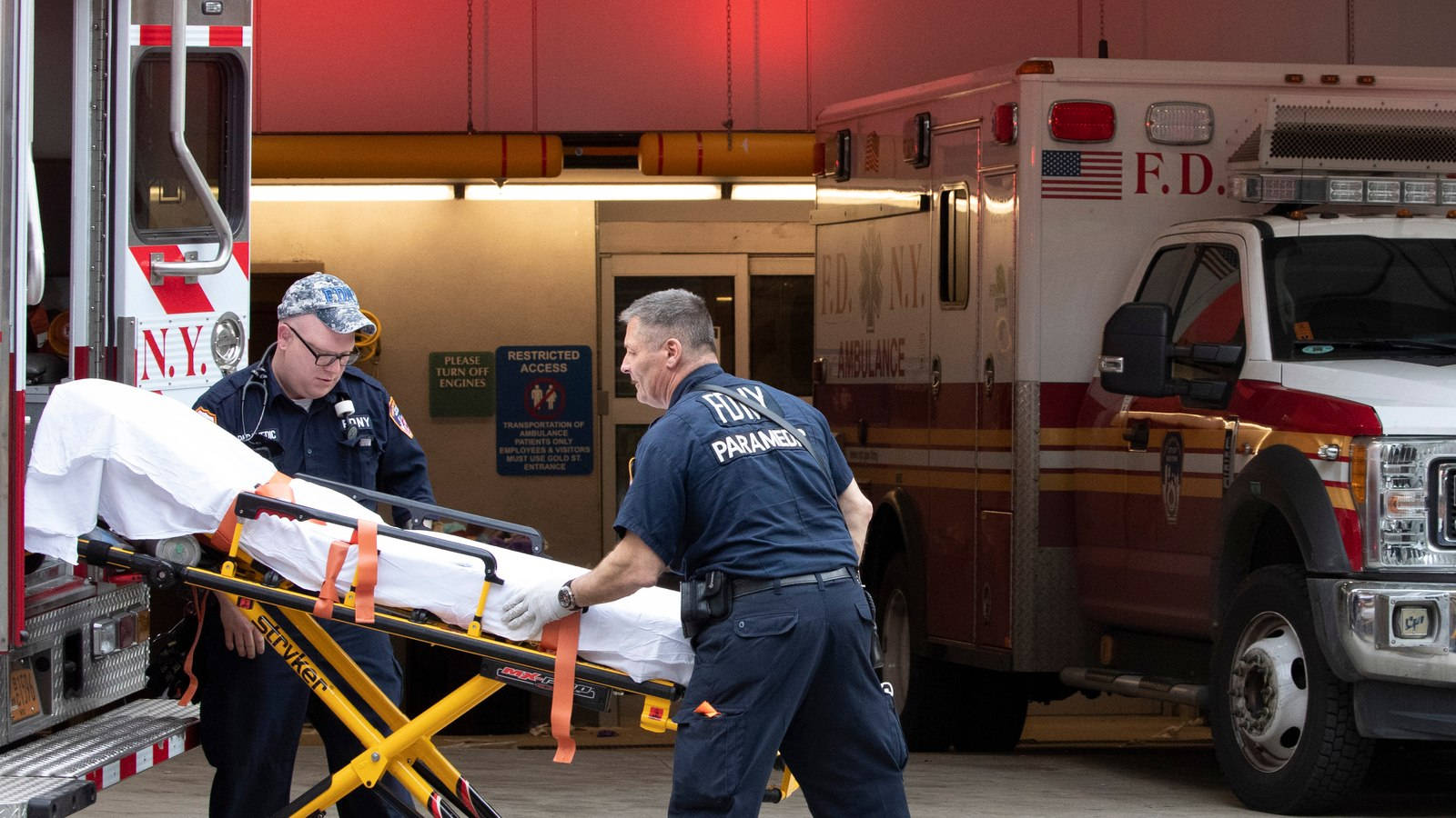 New York City Fire Department Paramedic Team In Action Background