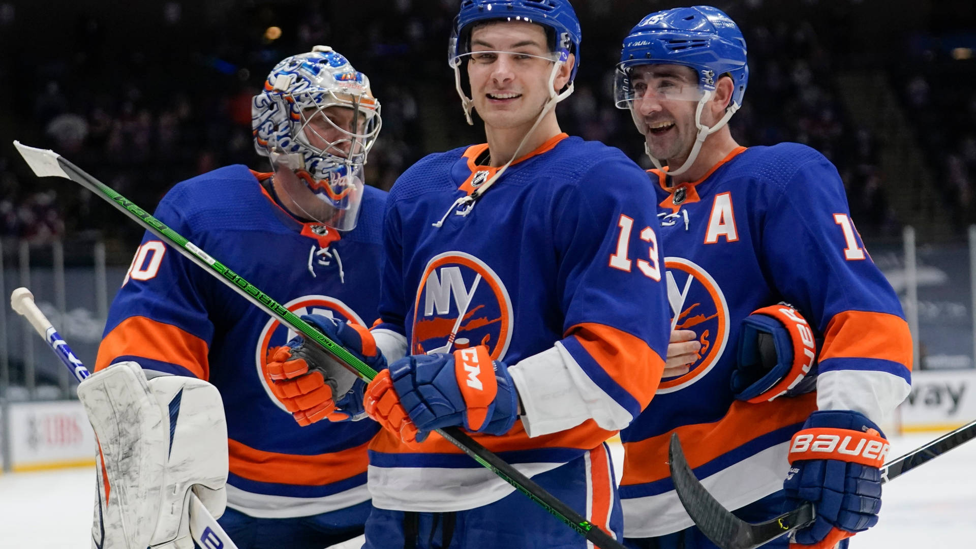 New York Islanders Ice Hockey Players Mathew Barzal And Teammates Background