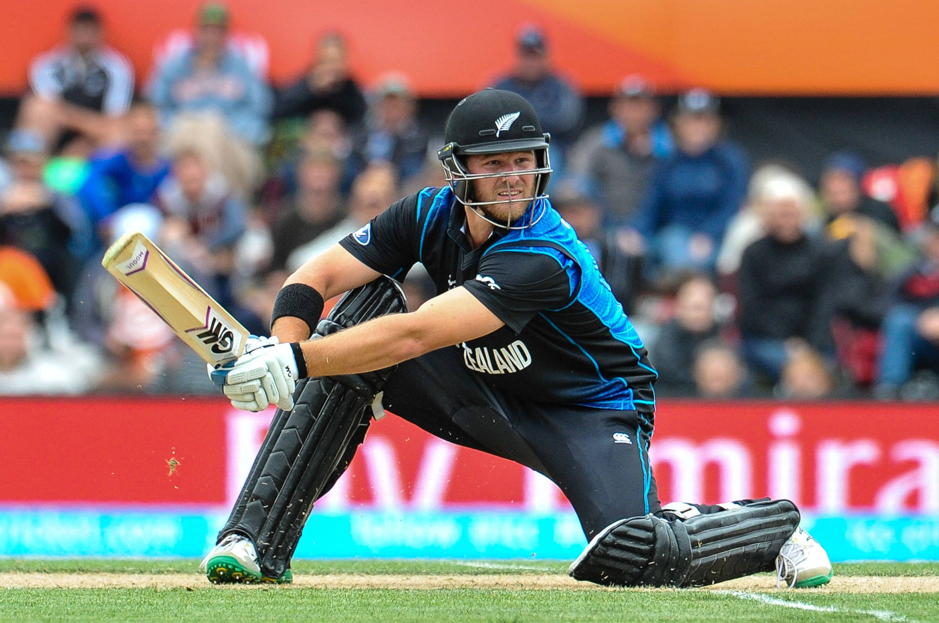 New Zealand Cricketer In Low Stance Posture Background
