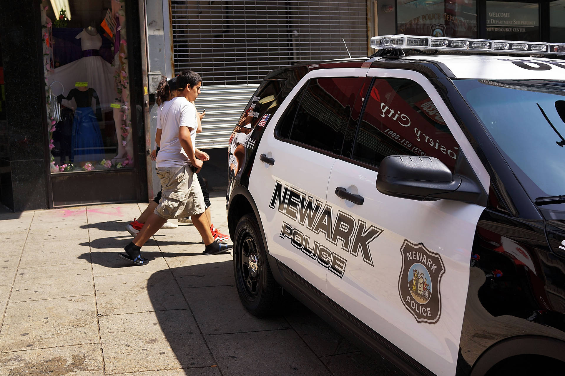 Newark Police Car Parked Outside Background