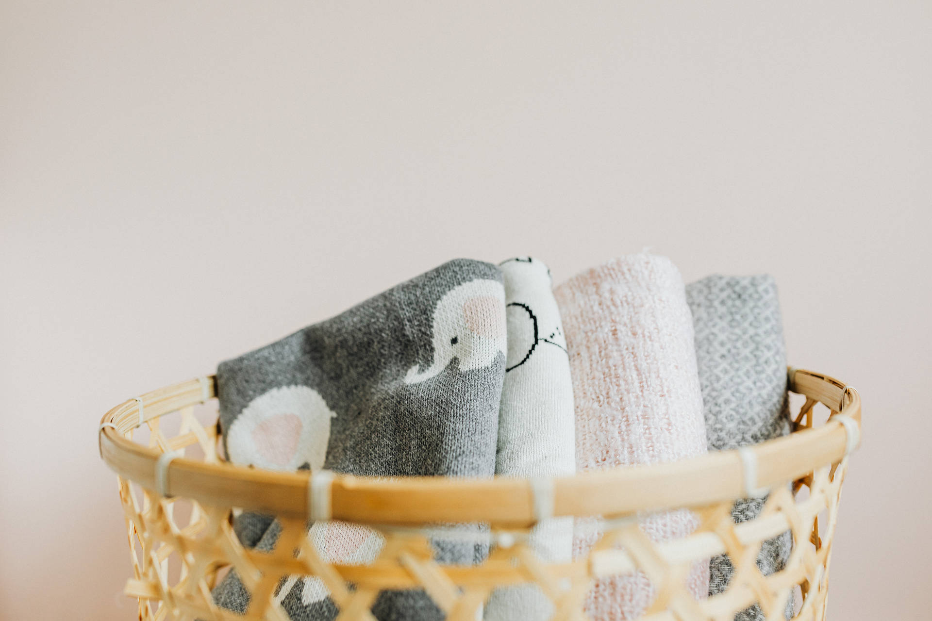 Newborn Baby Girl Cuddled In Elephant Blanket