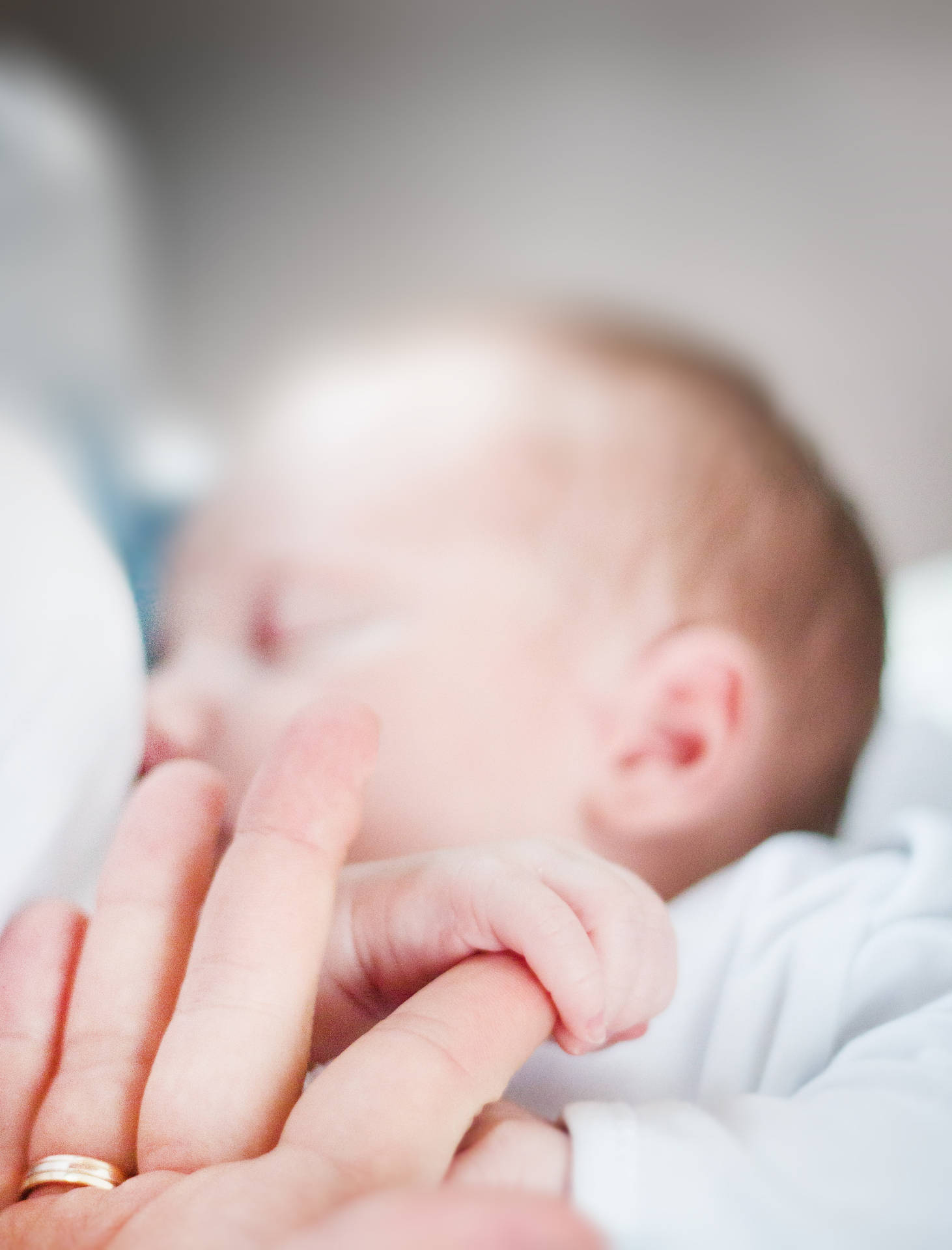 Newborn Baby Girl Gripping Background