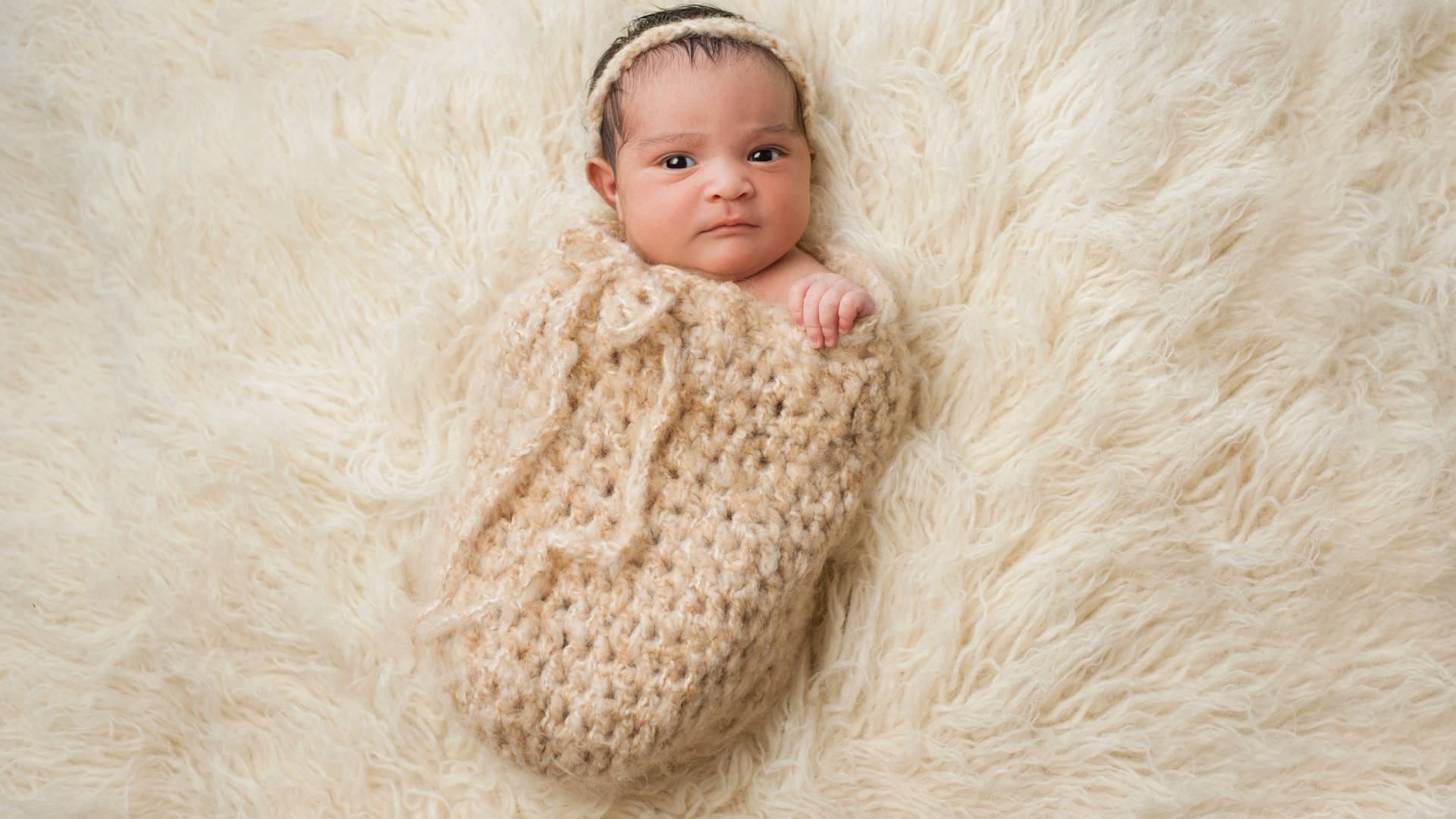 Newborn Baby Love On Faux Fur Background