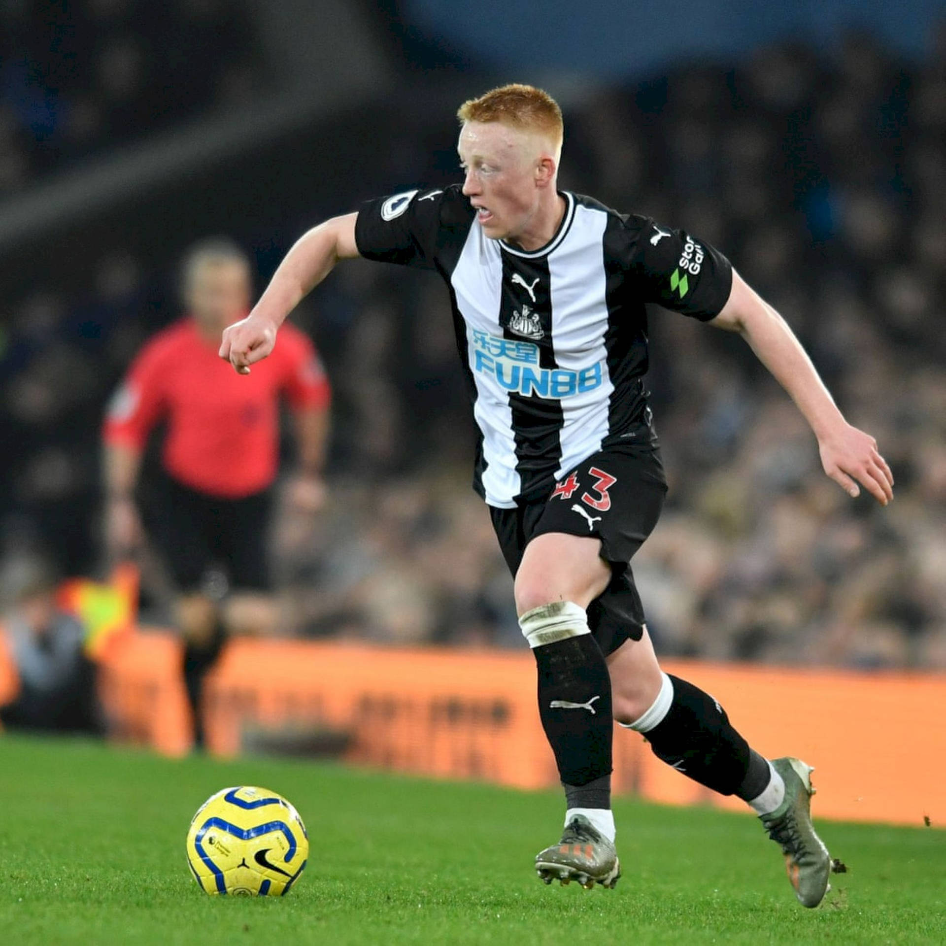 Newcastle United Fc Player Kicking Ball