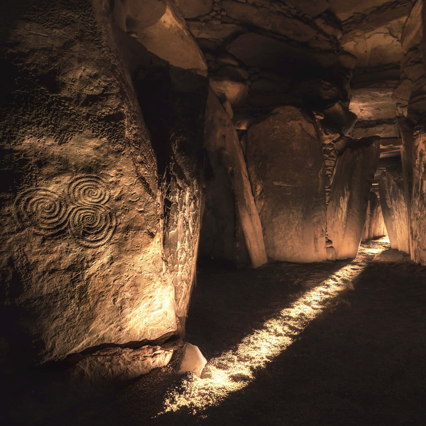 Newgrange Interior With Sunlight Passing Background