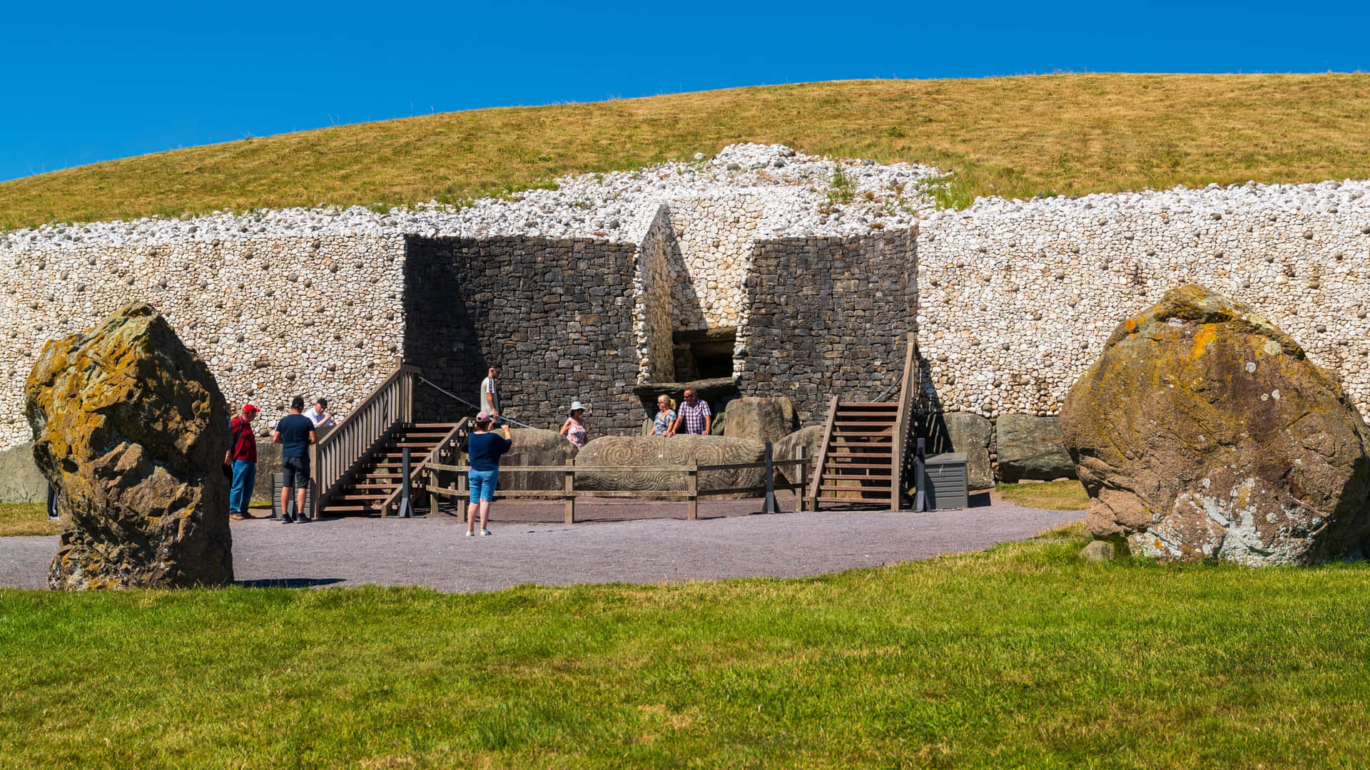 Newgrange With Tourists Taking Pictures Background