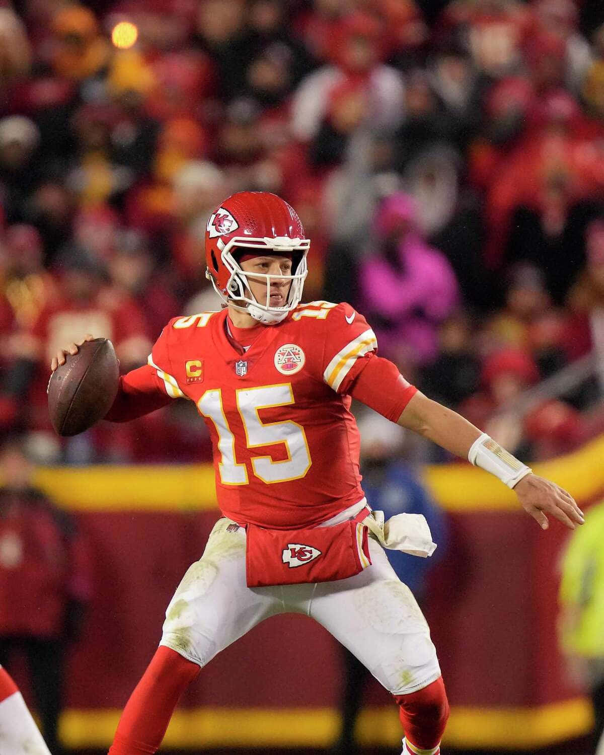 Nfl Superstar Quarterback Pat Mahomes With His Beloved Phone Background