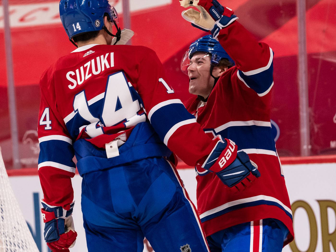 Nhl Professional Player Nick Suzuki And Cole Caufield Background