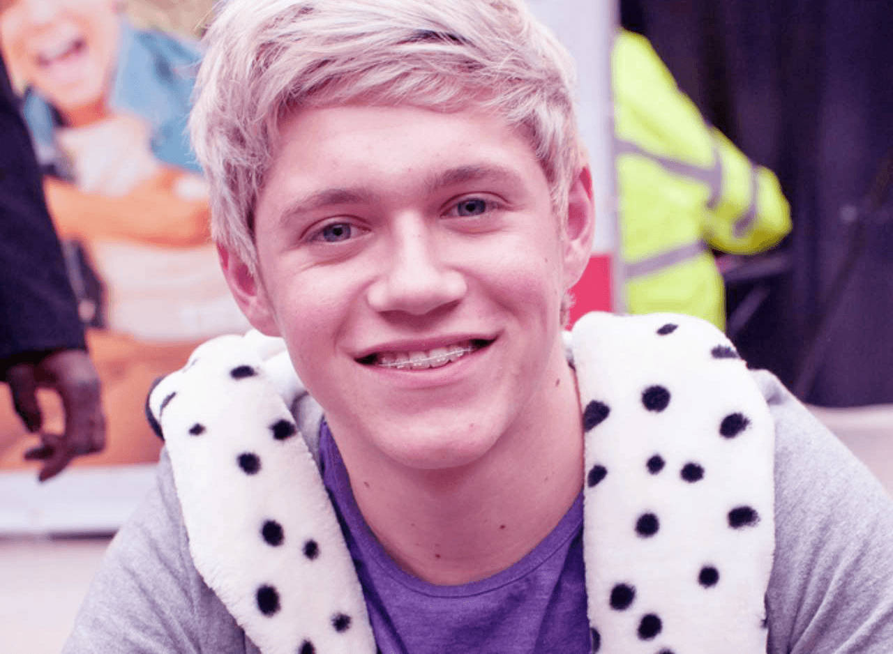 Niall Horan Braces Smile Background