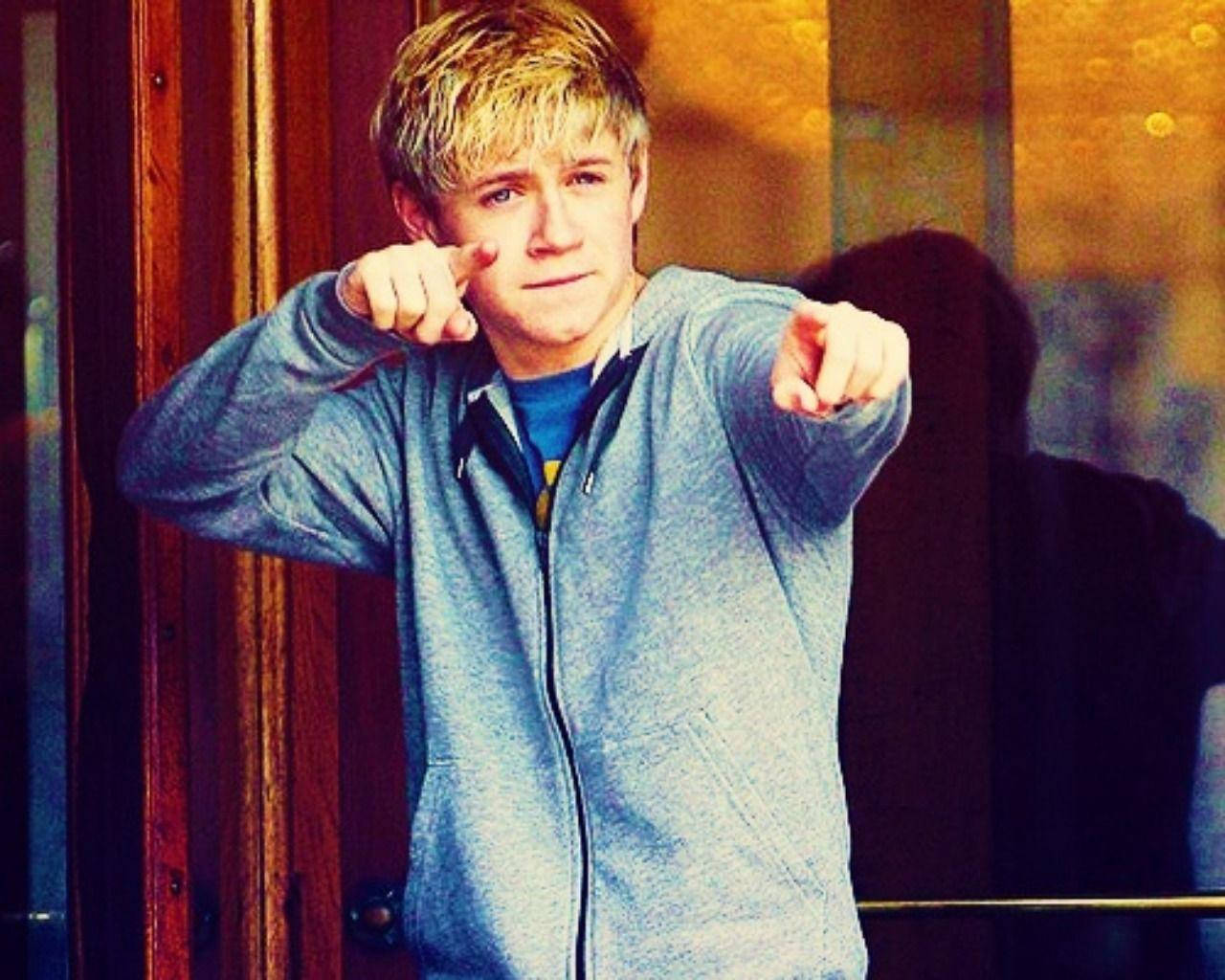 Niall Horan Jacket Pointing Background